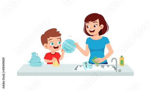 happy cute little boy washing dish with mother
