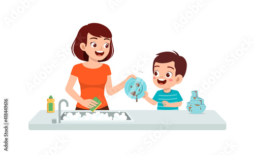 happy cute little boy washing dish with mother