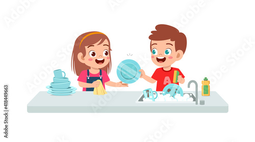 happy cute little boy and girl washing dish together