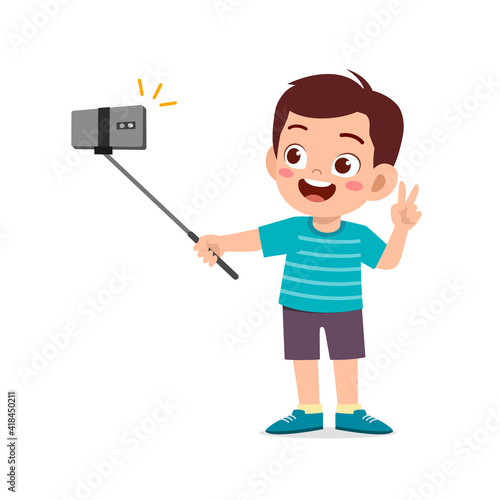 cute little kid boy pose and selfie in front of camera