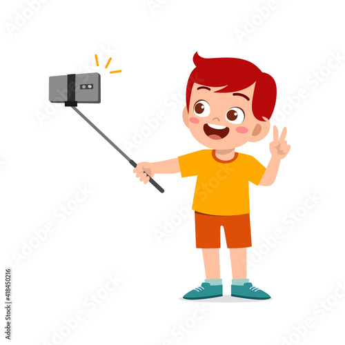 cute little kid boy pose and selfie in front of camera