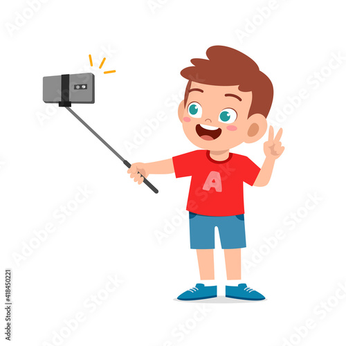 cute little kid boy pose and selfie in front of camera