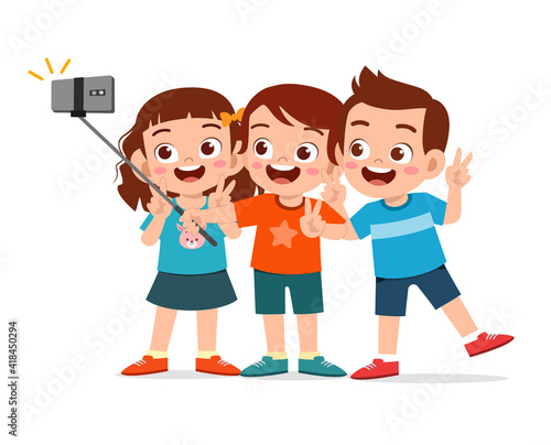 cute little boy and girl take selfie together