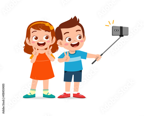cute little boy and girl take selfie together