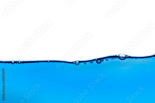 Water waves and light blue water droplets crystal clear on white background 