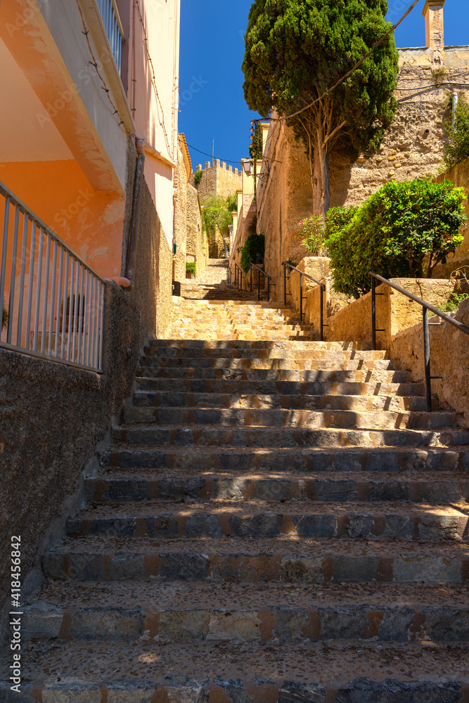Steps up to Capdepera castle on Mallorca island in Spain on a sunny day