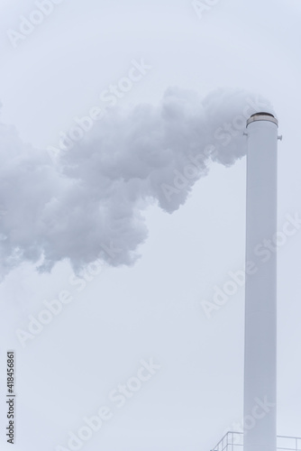 Smoke Stack Spewing into a Cold Winter Cloudy Sky