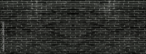 Old vintage retro style black bricks wall for brick background and texture. 