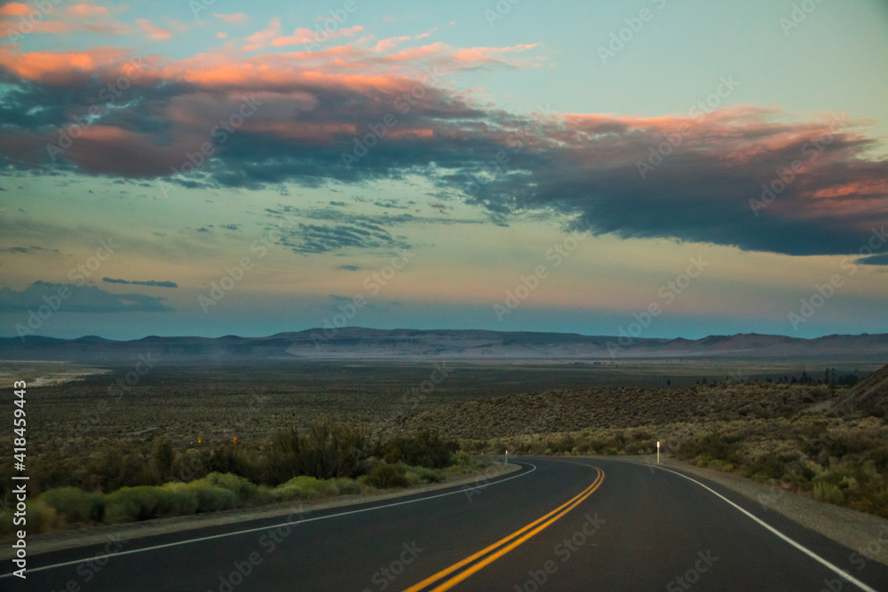 dramatic empty and lonely back road in the California desert.