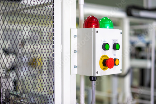 Factory 4.0 concept : View of operation panel and on fence of manufacturing machine.