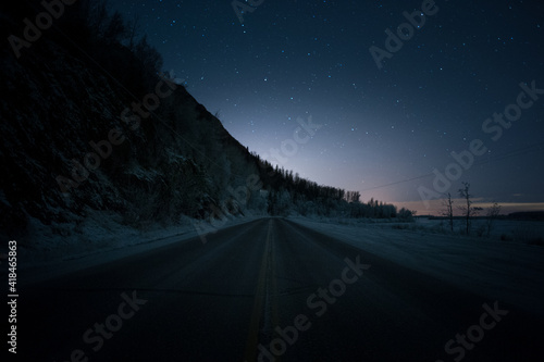 Alaska road at night with stars