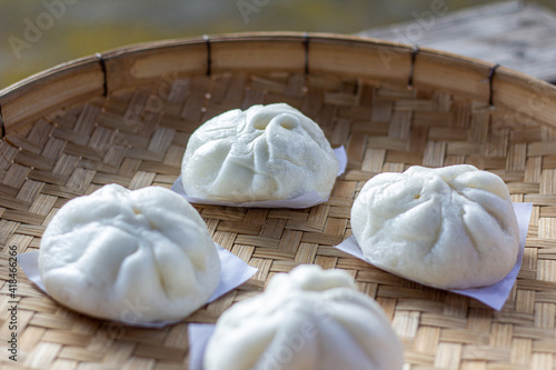 Steamed bun on bamboo basket in morning closeup focus corner