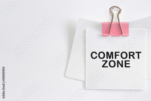 COMFORT ZONE text written on a paper. The concept of world business, marketing, finance.