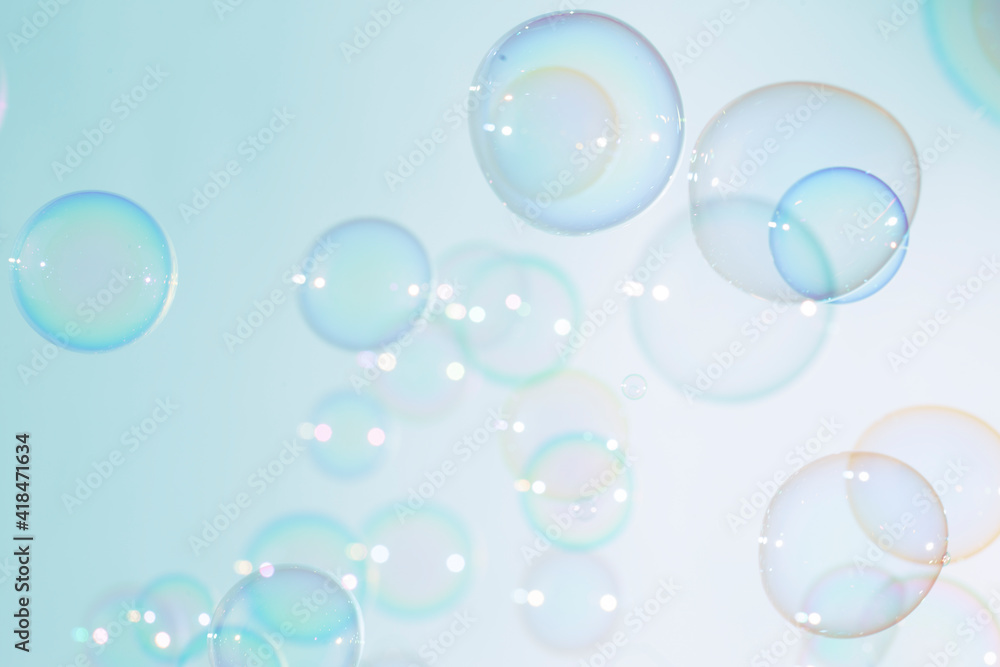 Beautiful transparent colorful soap bubbles float background. 