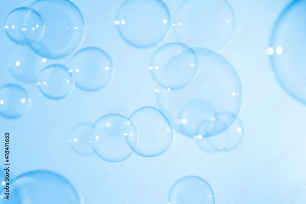 Natural Freshness Blur Transparent Blue Soap Bubbles Floating Background.