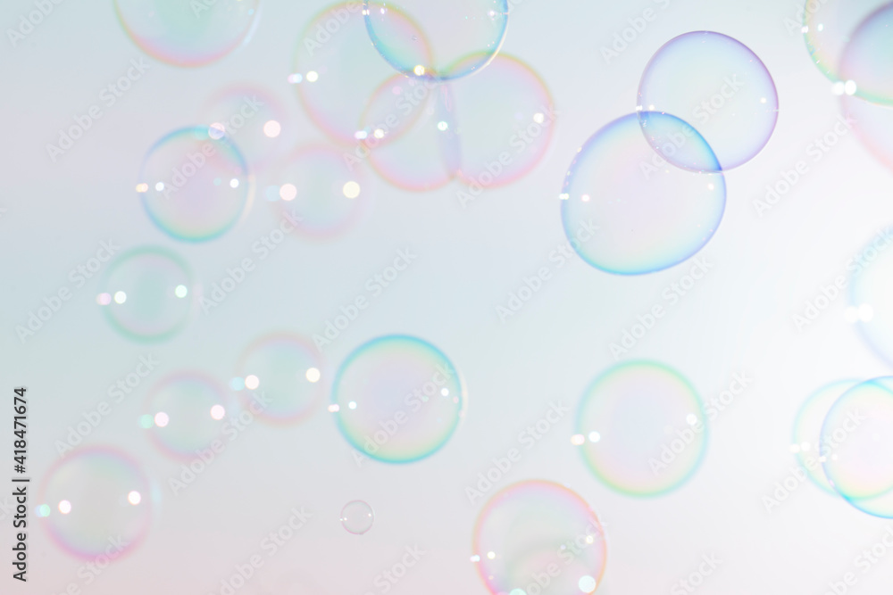 Beautiful blur transparent colorful soap bubbles floating background. 