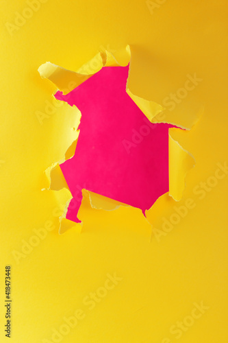 Wallpaper Mural Ripped torn yellow pink paper with hole in center with no people. Copy space for your promotional content, inscription or advertisement. Blank hole to insert object. Torn colored paper. Abstract shot. Torontodigital.ca
