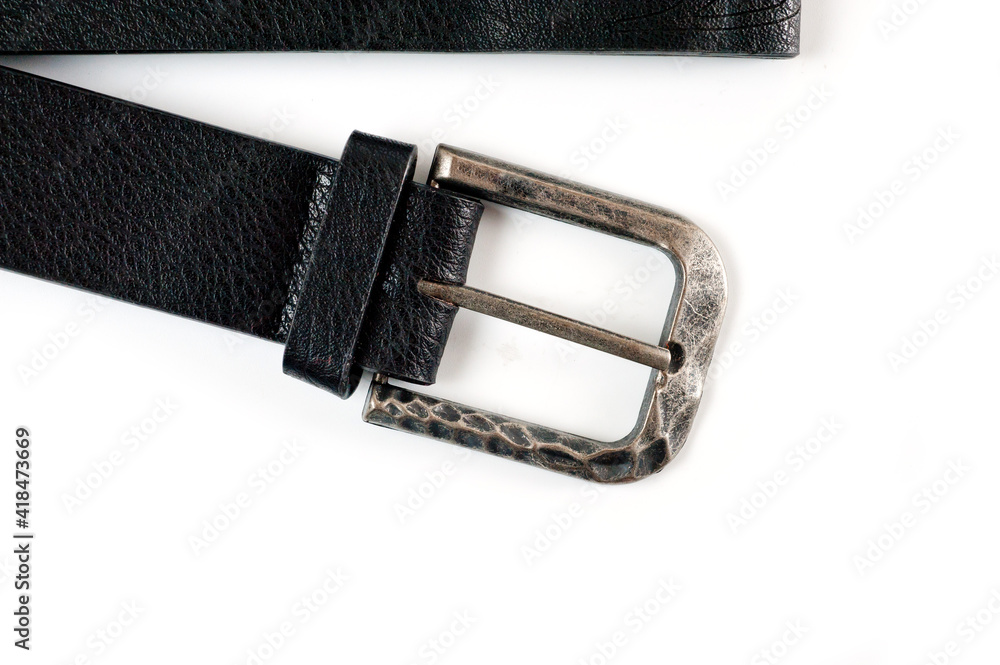 Black faux leather belt with classic buckle for trousers and jeans. Black faux leather belt with classic buckle for trousers and jeans.