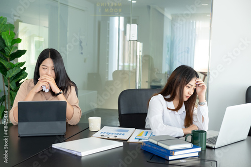 Cropped shot of businesswoman headache while working with laptop in the office. photo