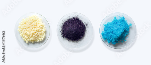 Cosmetic chemicals ingredient on laboratory table. Candelilla Wax, Potassium permanganate (KMnO4), Copper(II) sulfate. Top View photo