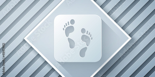 Paper cut Human footprint icon isolated on grey background. Trace of human foot. Paper art style. Vector.