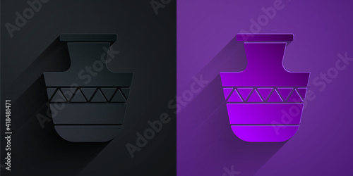 Paper cut Ancient amphorae icon isolated on black on purple background. Paper art style. Vector.