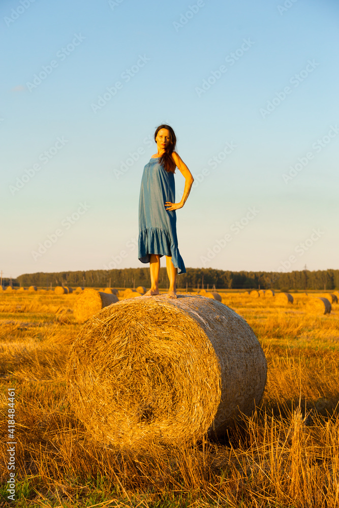 Beautiful woman walking in a wheat field Beautiful woman walking in a wheat field