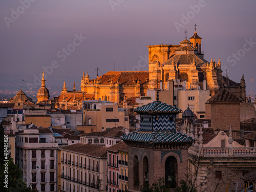 cathedral of granada bathed in golden sunlight at sunset in the old town of granada, spain