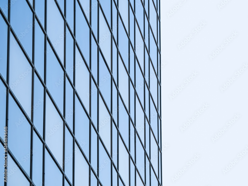 Modern glass office building against the clear blue sky. Abstract photography Modern glass office building against the clear blue sky. Abstract photography
