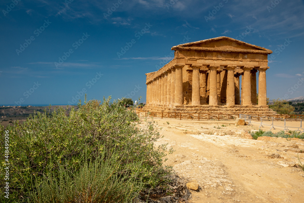 View of the Valle dei Templi near Agrigento in Sicily. A sunny morning with beautiful light emphasizes the charms of Greek ruins.
