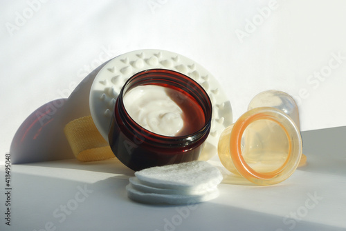 Set for anti-cellulite massage at home. Banks, massager and cream. Beauty and spa treatments.