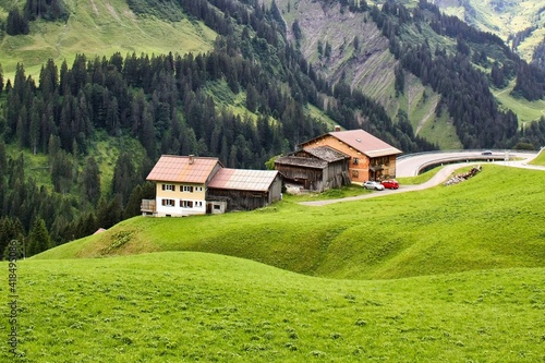 cultivated alps in a gently rolling landscape in the allgäu alps, germany