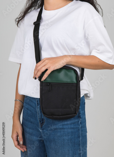 Woman carry the casual bag on shoulder with active and easy gesture
