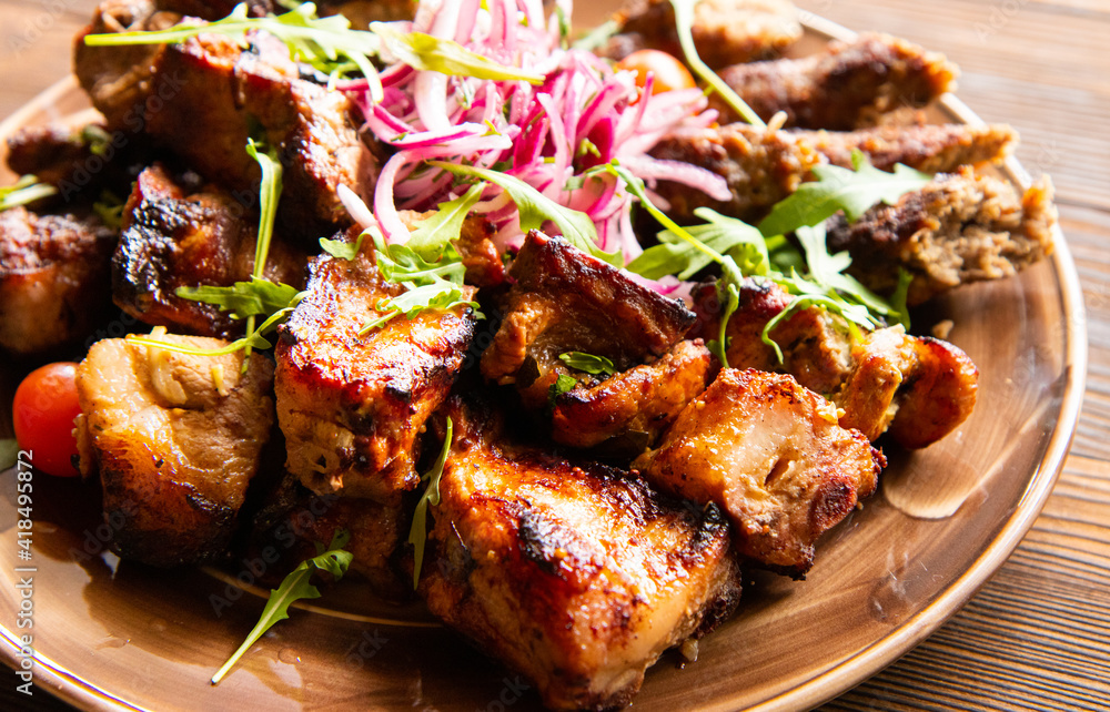 Assortment of different dishes on a plate, grilled meat, barbecue party - shish kebab, lula kebab