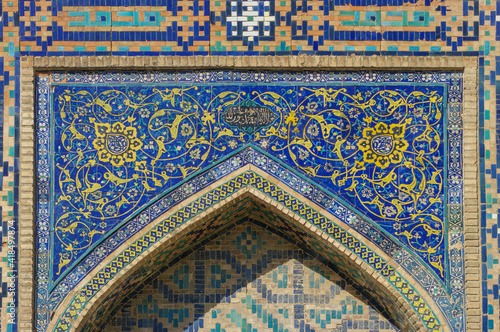 Beautiful blue mosaic decor in the courtyard of ancient Tilya Kori madrassa in UNESCO listed Samarkand, Uzbekistan