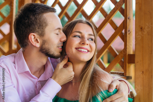 Portrait of amazing couple hugging closely with closed eyes, smi © Ivan