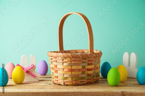 Sticker Empty basket with Easter eggs on wooden table