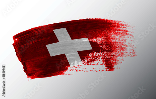 Switzerland flag illustrated on paint brush stroke