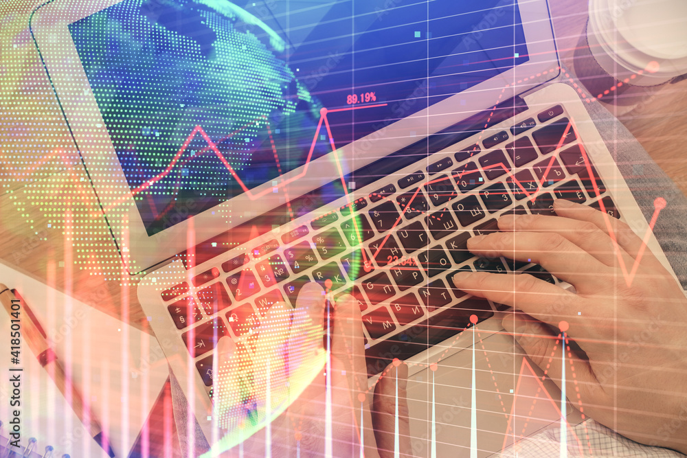 Double exposure of man's hands typing over computer keyboard and forex graph hologram drawing. Top view. Financial markets concept. Double exposure of man's hands typing over computer keyboard and forex graph hologram drawing. Top view. Financial markets concept.