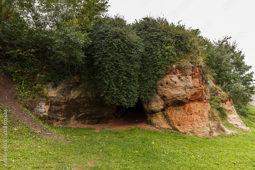 Exposed rocky cliff with caves in Tori, Estonia. Local name - Devil's caves