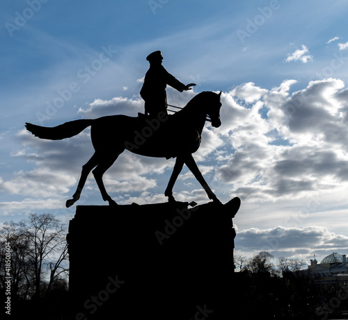 A monument silhouette to Marshal Zhukov on a horse that stands in the center of Moscow by the Kremlin.