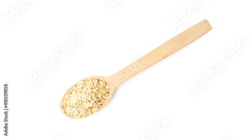 wooden spoon with oatmeal isolated on white