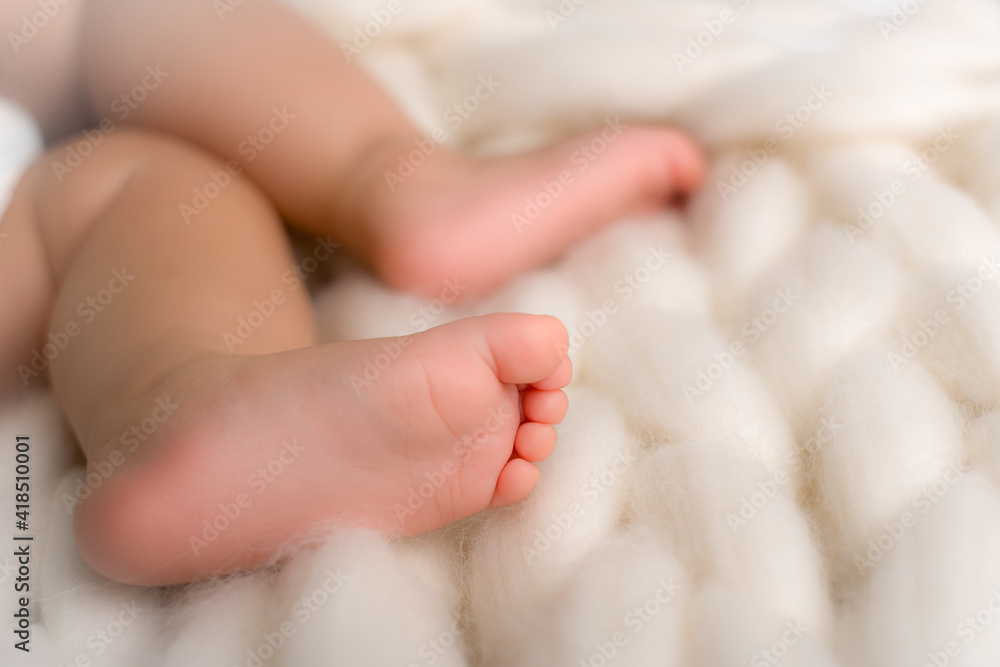 small pink feet of the baby close up small pink feet of the baby close up