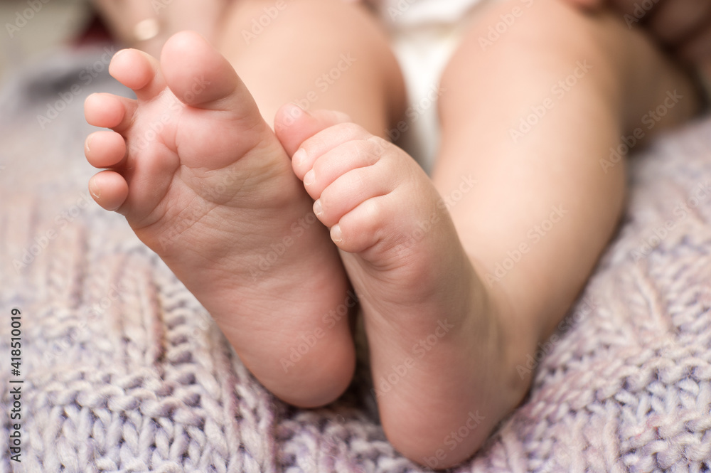 small pink feet of the baby close up small pink feet of the baby close up