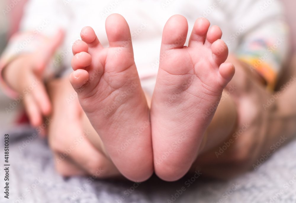small pink feet of the baby close up small pink feet of the baby close up