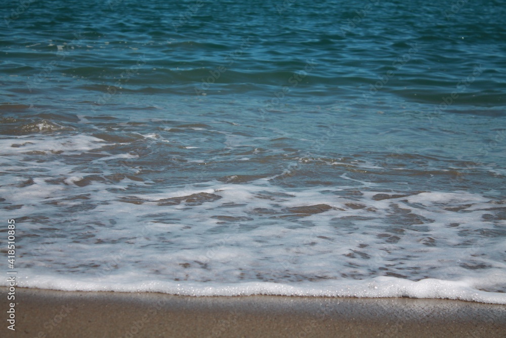 sea ​​shore. Blue waves on the blue sea. Sea shore. Sand. Summer.