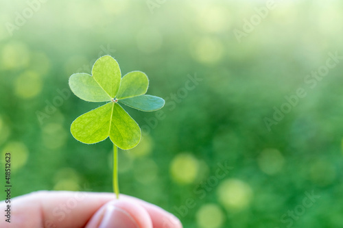 Luck charm. St. Patrick's Day green shamrock with copy space. Background, card, poster or banner in high resolution © Joao