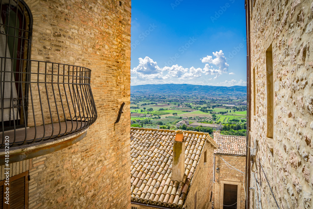 City of Assisi view to the fields around the city between the buildings