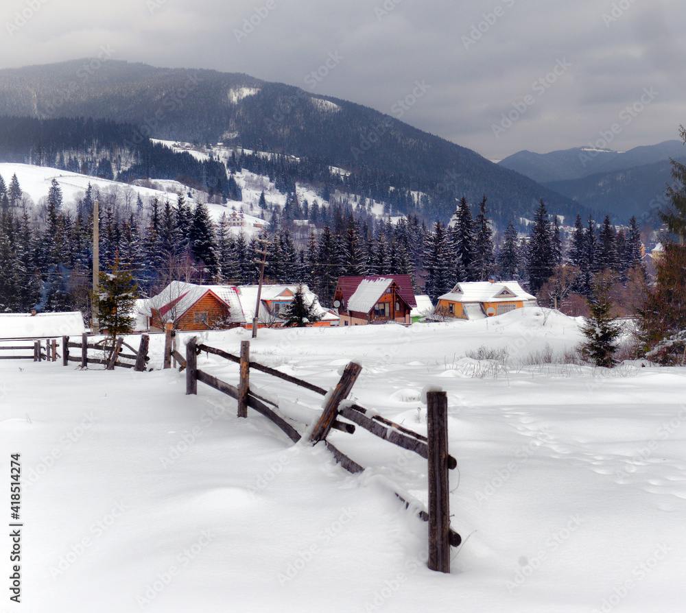 Typical landscape of the Ukrainian Carpathians with private estates in winter Typical landscape of the Ukrainian Carpathians with private estates in winter