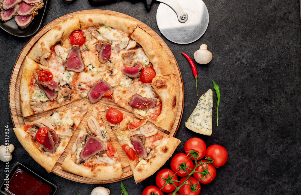 delicious meat pizza on a stone background with copy space for your text